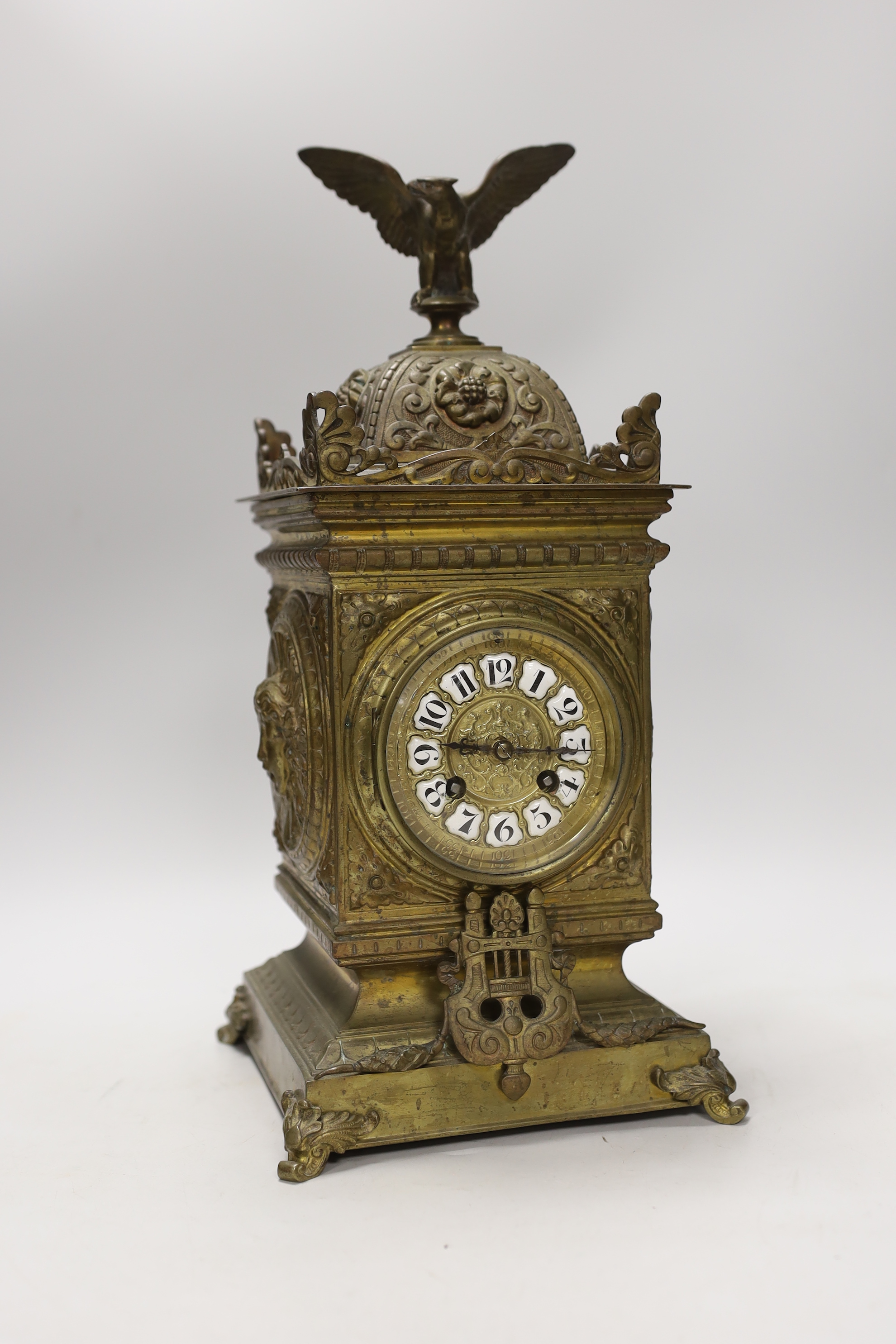 A French brass eagle mounted mantel clock, with ornate dial, 41cm high